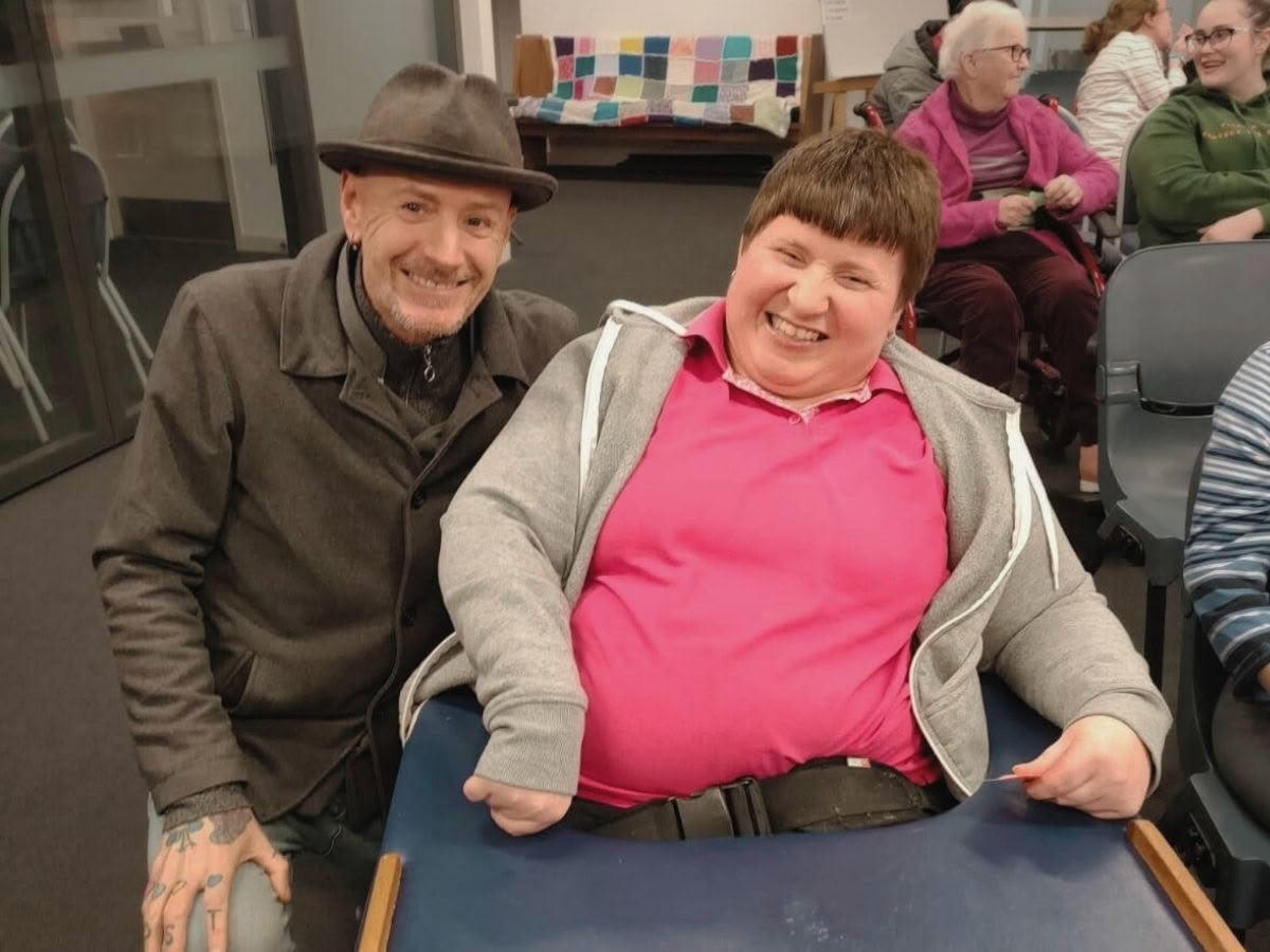 Volunteer Colin having a laugh with a community member at the Delta Community Trust